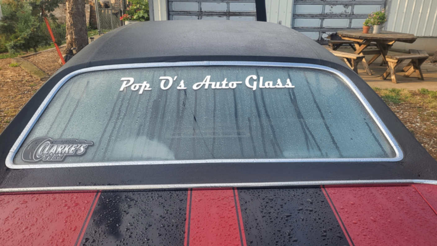 Pop O's Auto Glass lettering on rear windshield