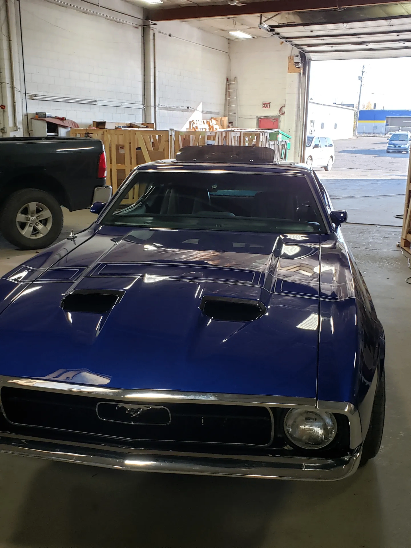 Blue Mustang in the shop
